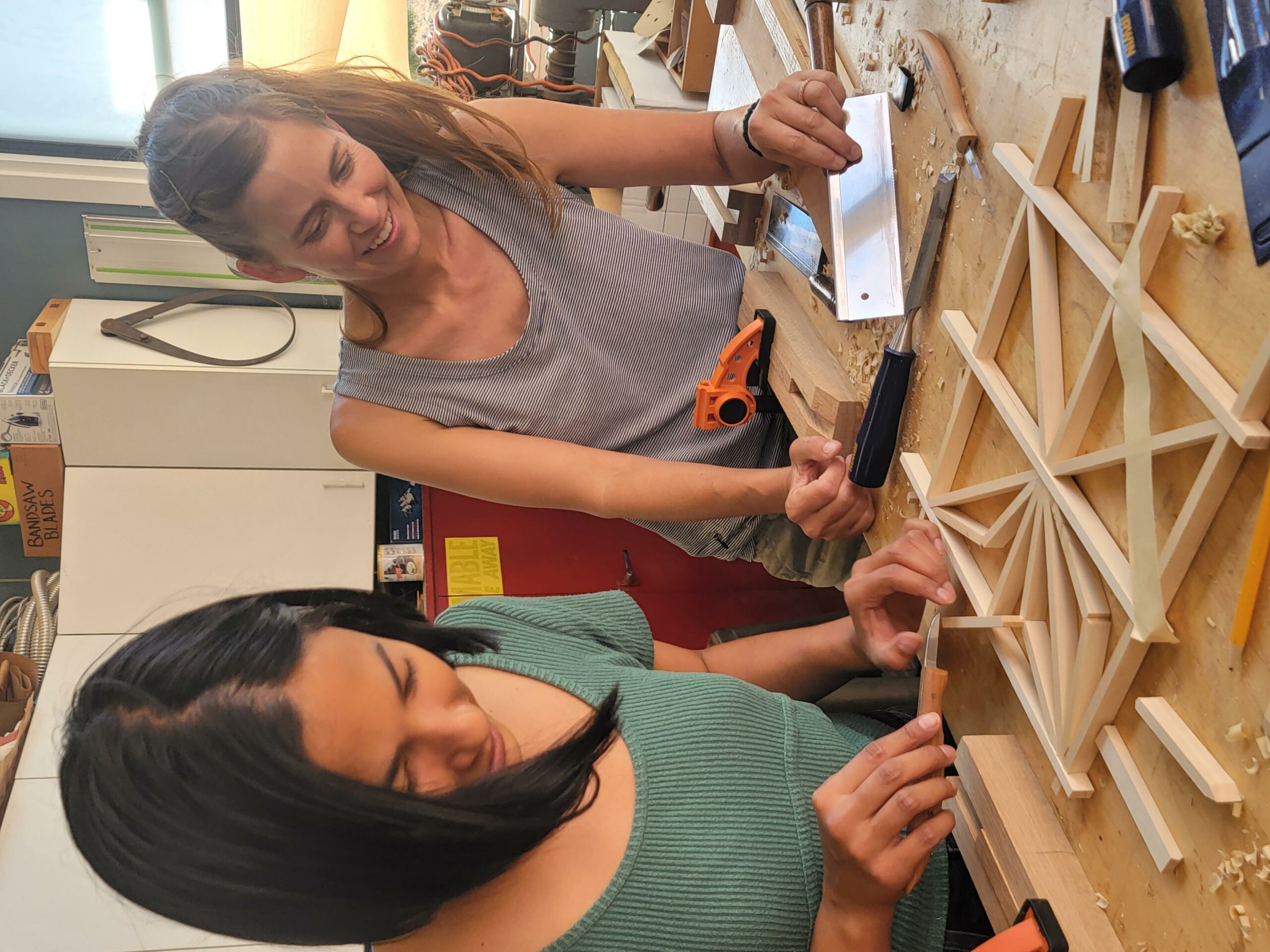 two women work on Japanese Kumiko woodworking technique at San Diego Craft Collective